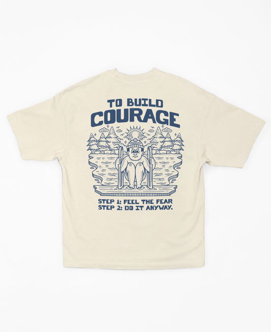 Build Courage 101Suit up with our 'Build Courage 101' tee! Featuring the bold mantra, 'Feel the fear and do it anyway,' this shirt is your go-to gear for tackling life's big leaps. WSuit up with our 'Build Courage 101' tee! Featuring the bold mantra, 'Feel the fear and do it anyway,' this shirt is your go-to gear for tackling life's big leaps. WThe Frigid CollectiveThe Frigid CollectiveBuild Courage 101