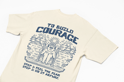 Build Courage 101Suit up with our 'Build Courage 101' tee! Featuring the bold mantra, 'Feel the fear and do it anyway,' this shirt is your go-to gear for tackling life's big leaps. WSuit up with our 'Build Courage 101' tee! Featuring the bold mantra, 'Feel the fear and do it anyway,' this shirt is your go-to gear for tackling life's big leaps. WThe Frigid CollectiveThe Frigid CollectiveBuild Courage 101